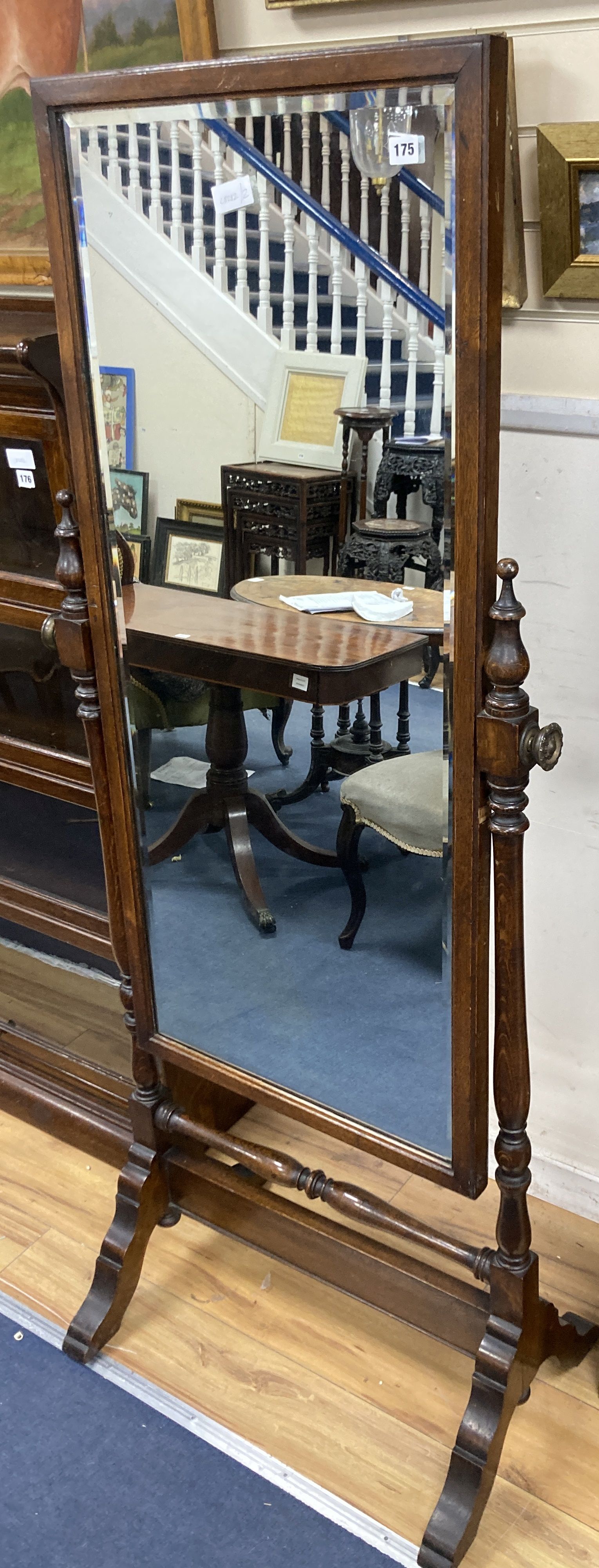 A 1920s oak cheval mirror, width 68cm height 164cm